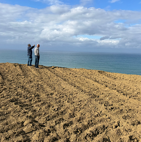 two men overlooking the ocean at santo tomas